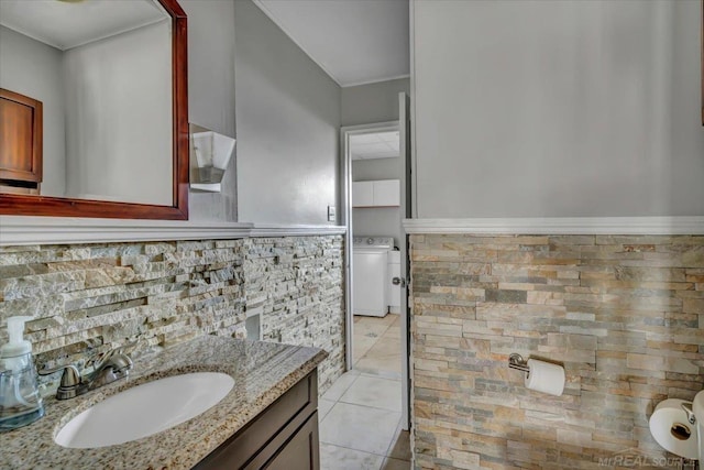 29094 Herbert St, Madison Heights, MI 48071 - bathroom featuring tile patterned floors, washer / dryer, ornamental molding, and vanity
