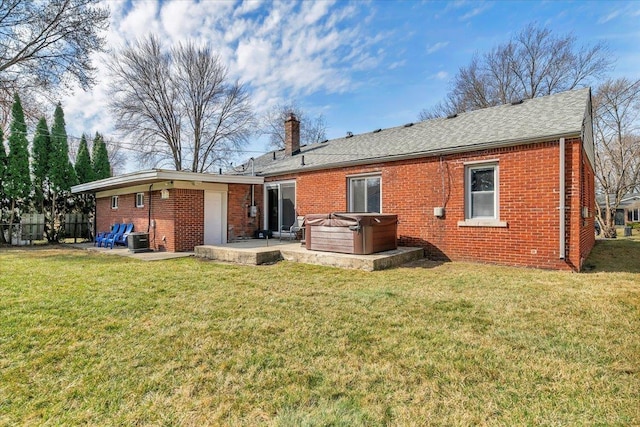 29094 Herbert St, Madison Heights, MI 48071 - back of property featuring a hot tub, brick siding, a chimney, and a patio