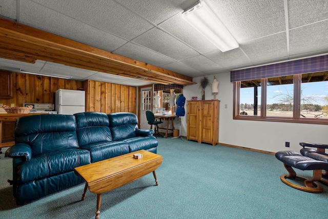 carpeted living room with baseboards