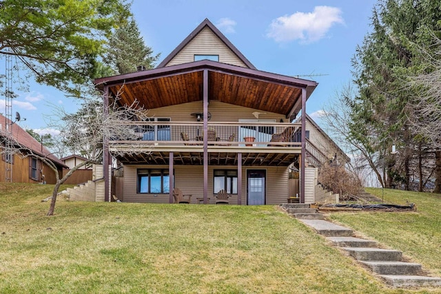 back of property with a lawn and a wooden deck