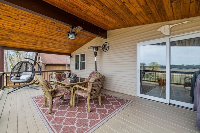 wooden deck featuring outdoor dining area