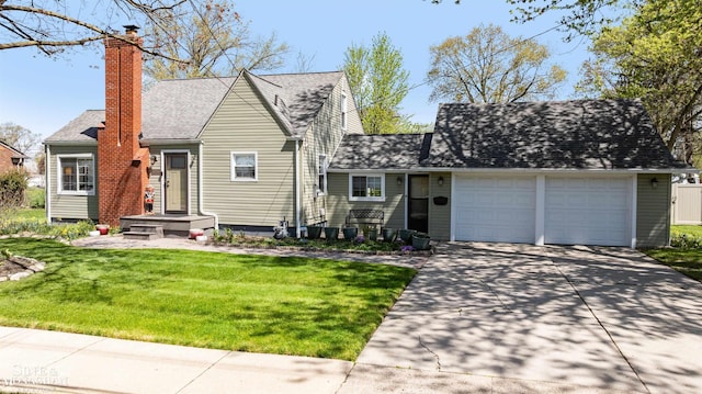 view of front of home featuring a front lawn, a chimney, a shingled roof, concrete driveway, and an attached garage