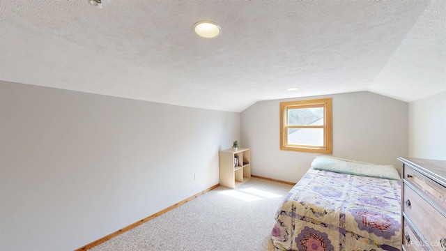 bedroom featuring baseboards, a textured ceiling, carpet floors, and vaulted ceiling