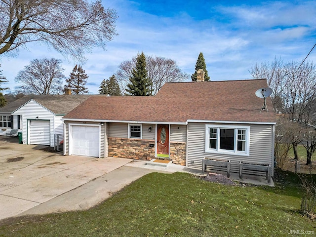 view of front facade with an attached garage, stone siding, a front yard, a chimney, and driveway