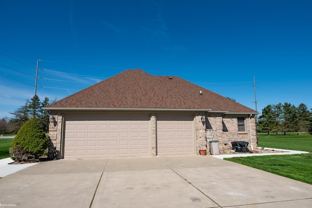 view of property exterior with a lawn, a garage, brick siding, concrete driveway, and a shingled roof