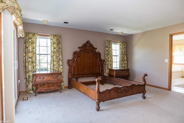 carpeted bedroom with baseboards