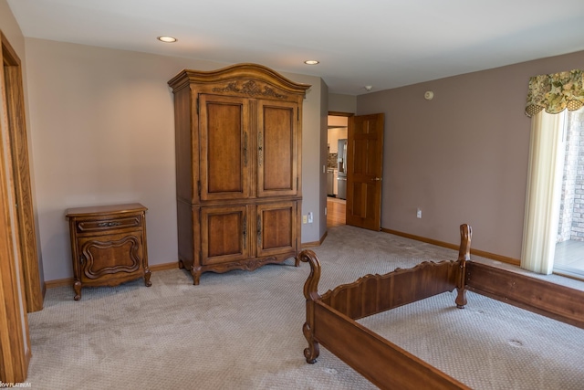 bedroom with light colored carpet, recessed lighting, and baseboards