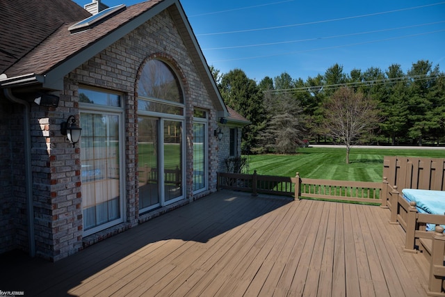 wooden deck with a yard