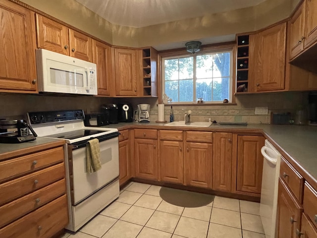 kitchen featuring open shelves, white appliances, brown cabinets, a sink, and light tile patterned floors