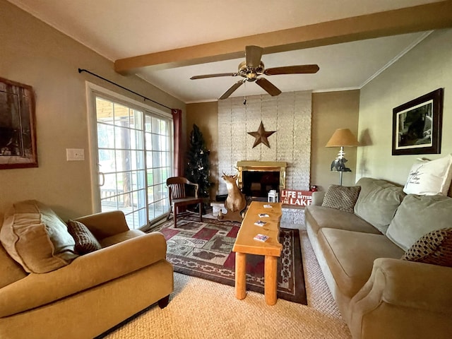 carpeted living room featuring ornamental molding, a fireplace, a ceiling fan, and beam ceiling