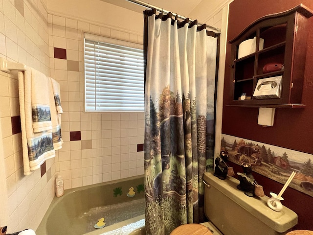 bathroom featuring toilet and shower / tub combo with curtain