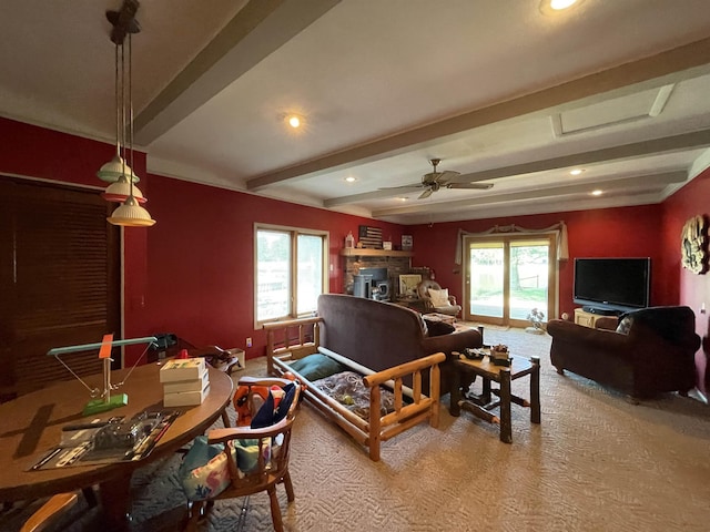 living area with carpet flooring, recessed lighting, a healthy amount of sunlight, and beam ceiling