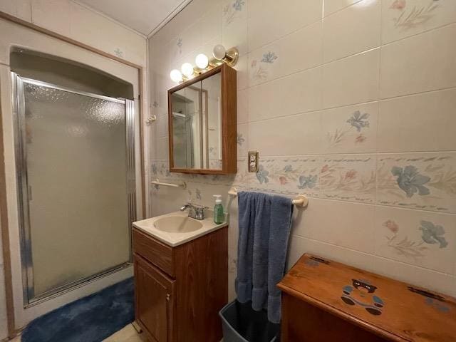 full bath with a shower stall and vanity