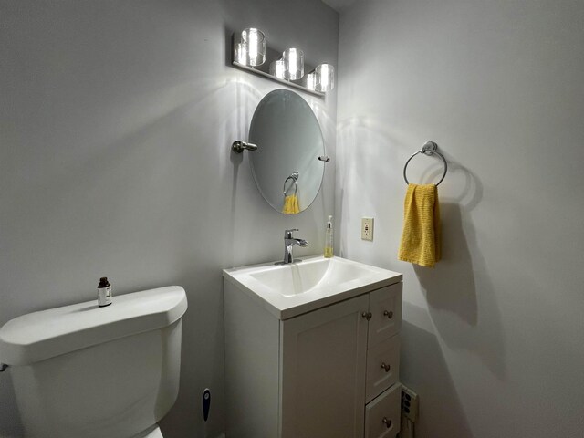 half bath with toilet and vanity