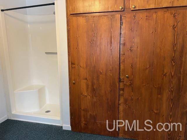 interior space with baseboards and carpet