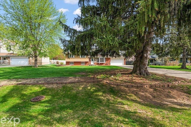 view of front of home with driveway and a front yard