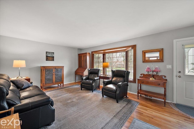 living room featuring light wood-style floors and baseboards