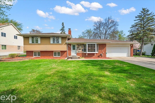 split level home with brick siding, a garage, a front yard, a chimney, and concrete driveway