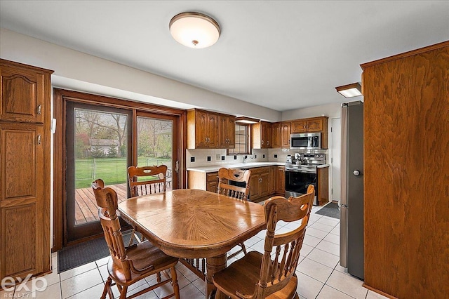 dining space with light tile patterned flooring