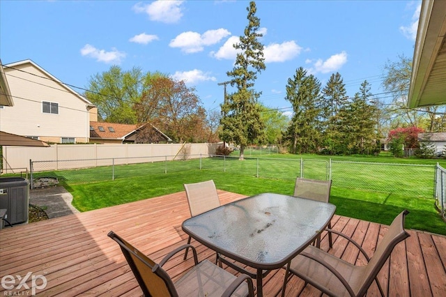 wooden terrace featuring a yard, central AC unit, a fenced backyard, and outdoor dining space