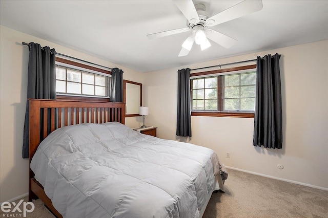 bedroom with baseboards, ceiling fan, and carpet