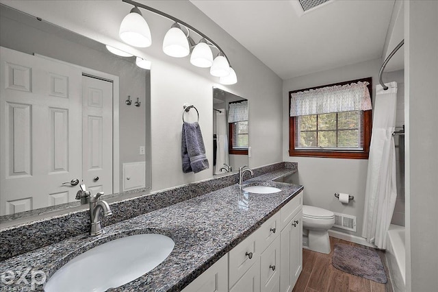 full bathroom with visible vents, a sink, and toilet