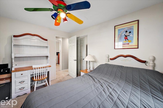 bedroom featuring ceiling fan and light carpet