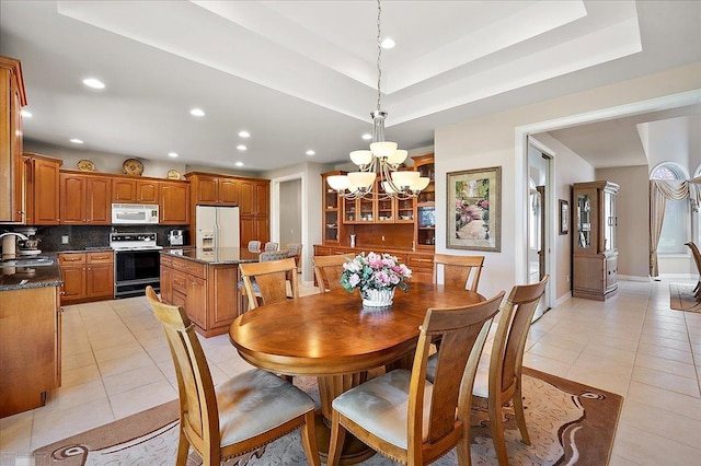 15113 Totten Pl, Shelby Twp, MI 48315 - dining area featuring recessed lighting, an inviting chandelier, and light tile patterned floors
