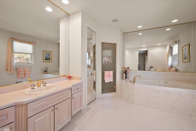 15113 Totten Pl, Shelby Twp, MI 48315 - bathroom with a bath, visible vents, a stall shower, vanity, and recessed lighting