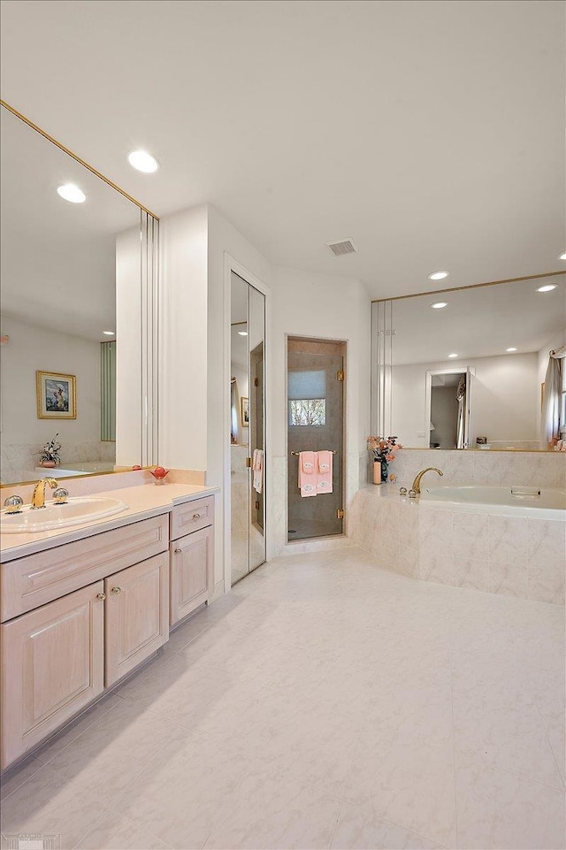 15113 Totten Pl, Shelby Twp, MI 48315 - bathroom featuring vanity, recessed lighting, a bath, and tile patterned floors