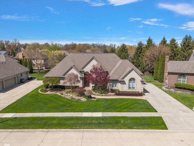 15113 Totten Pl, Shelby Twp, MI 48315 - view of front of house with driveway and a front yard
