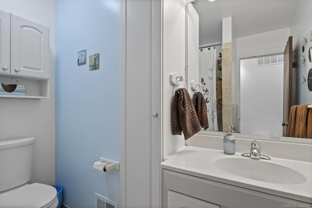full bath with toilet and vanity