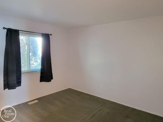 unfurnished room featuring carpet flooring and visible vents
