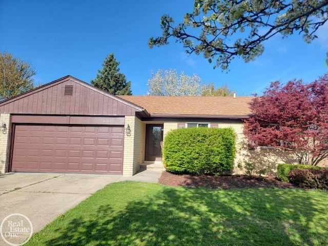 ranch-style home with a garage, a front lawn, and brick siding