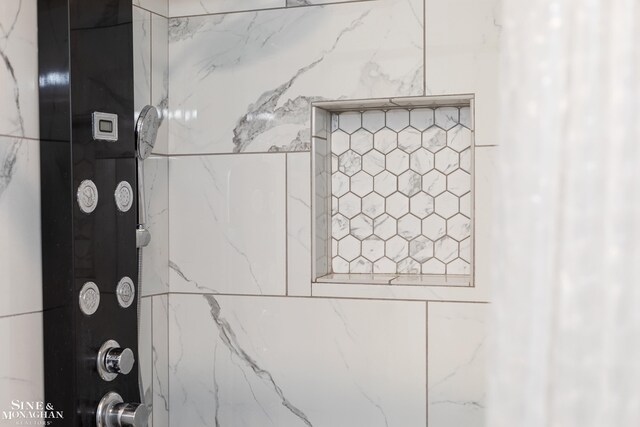 interior details featuring walk in shower