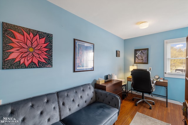 home office with wood finished floors