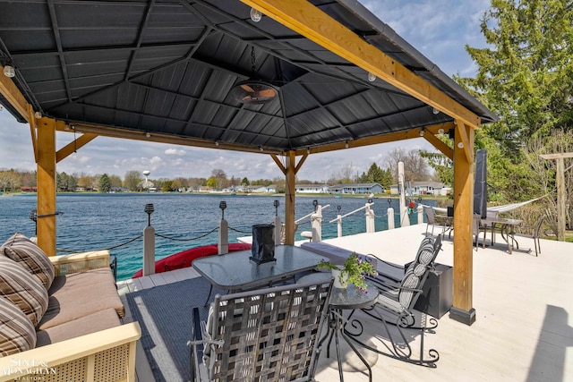 view of dock featuring a water view and a gazebo