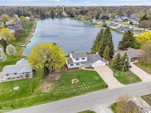 drone / aerial view featuring a residential view and a water view