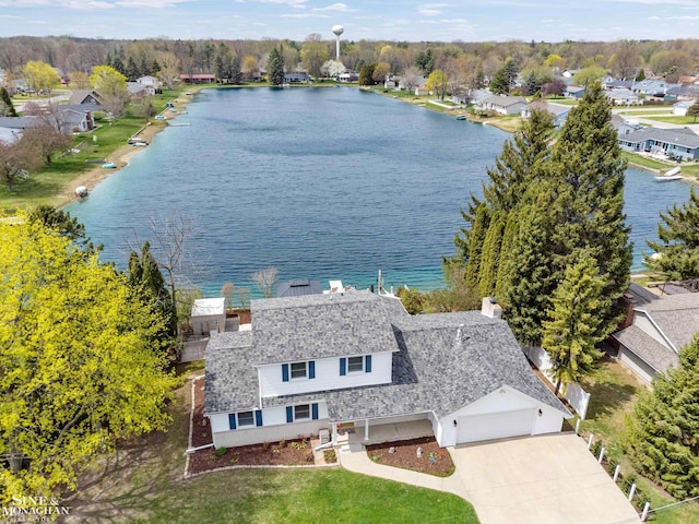 aerial view featuring a water view and a residential view