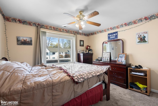 bedroom featuring carpet flooring, ceiling fan, and visible vents
