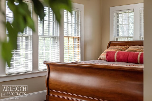 bedroom with multiple windows