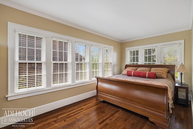 bedroom featuring baseboards, ornamental molding, dark wood-type flooring, and multiple windows