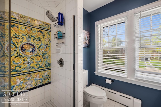 full bathroom with tile patterned flooring, a stall shower, toilet, and a wealth of natural light