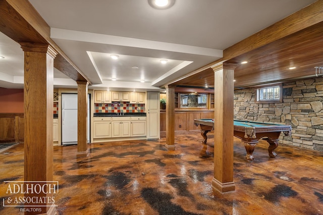 playroom featuring ornate columns, bar, concrete flooring, and pool table