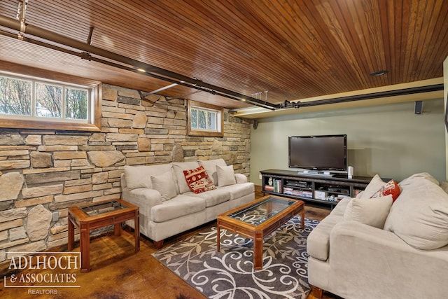 living room with wooden ceiling, wood finished floors, and plenty of natural light