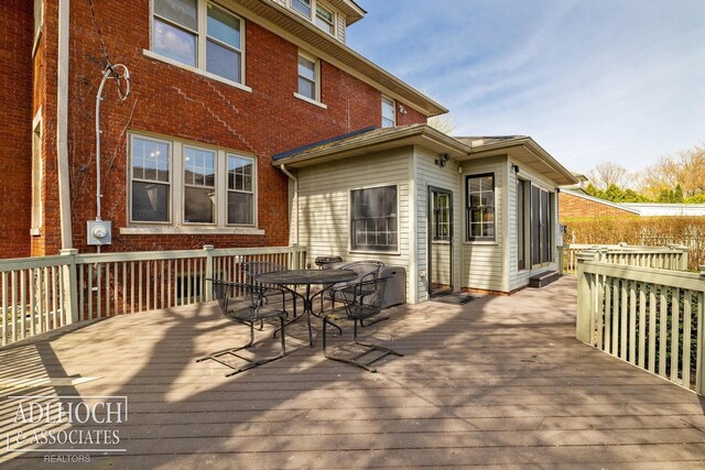 deck featuring outdoor dining space
