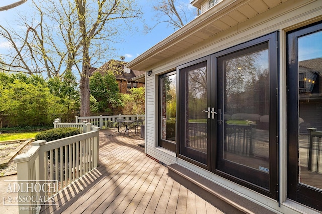 deck with outdoor dining space
