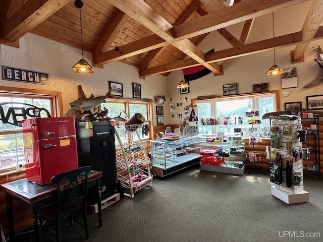 misc room featuring carpet flooring, beamed ceiling, wood ceiling, and high vaulted ceiling