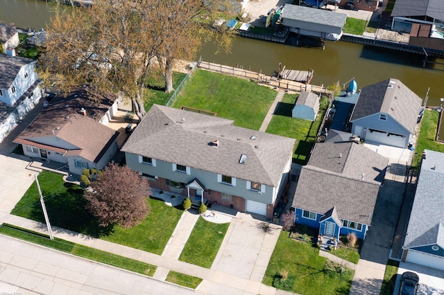 bird's eye view with a water view and a residential view