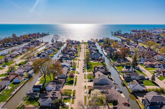 birds eye view of property with a water view and a residential view